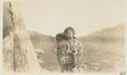 Image of Eskimo [Inughuit] girl tending baby